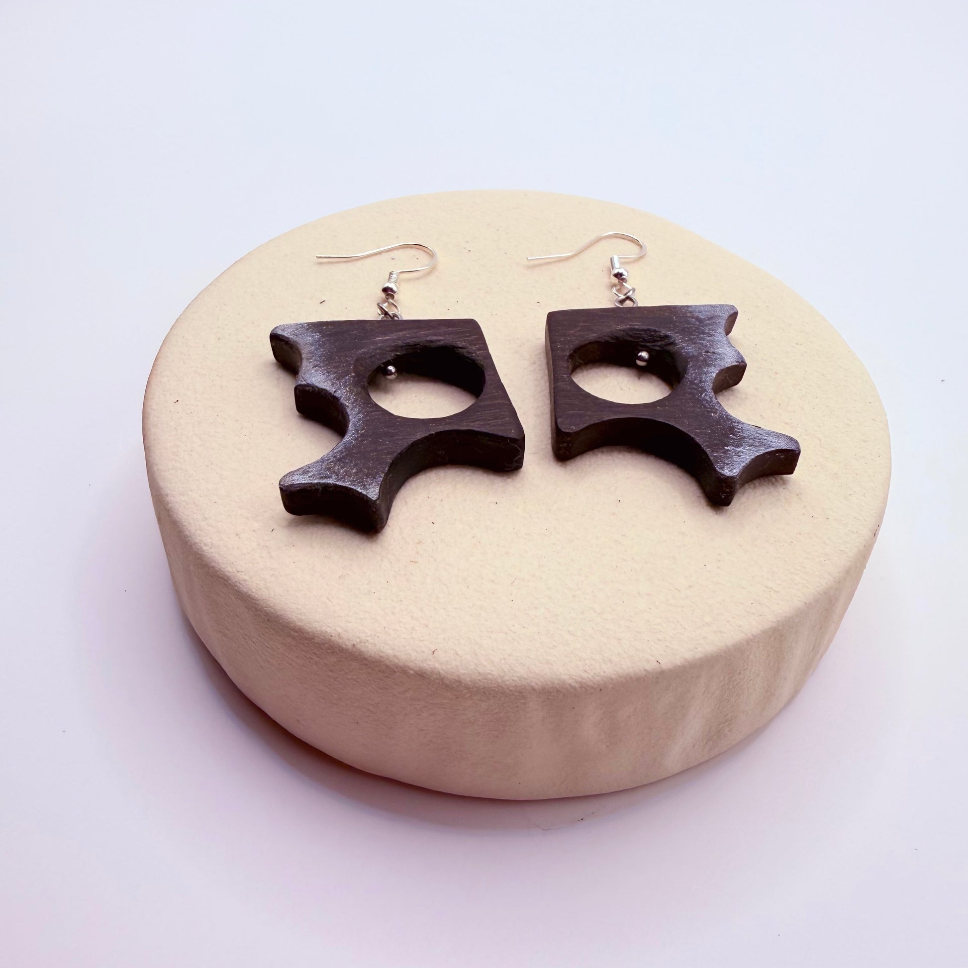 Detail view of geometric bog oak earrings with matte finish