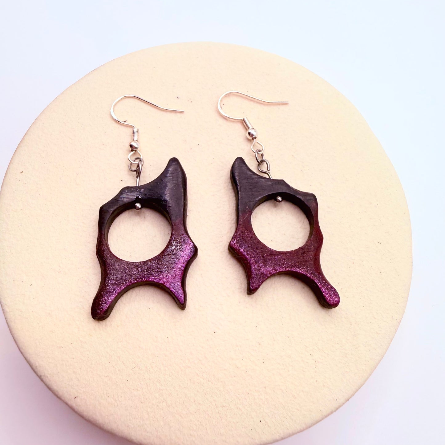 Handmade dangling earrings made from bog oak with abstract shape in purple and black