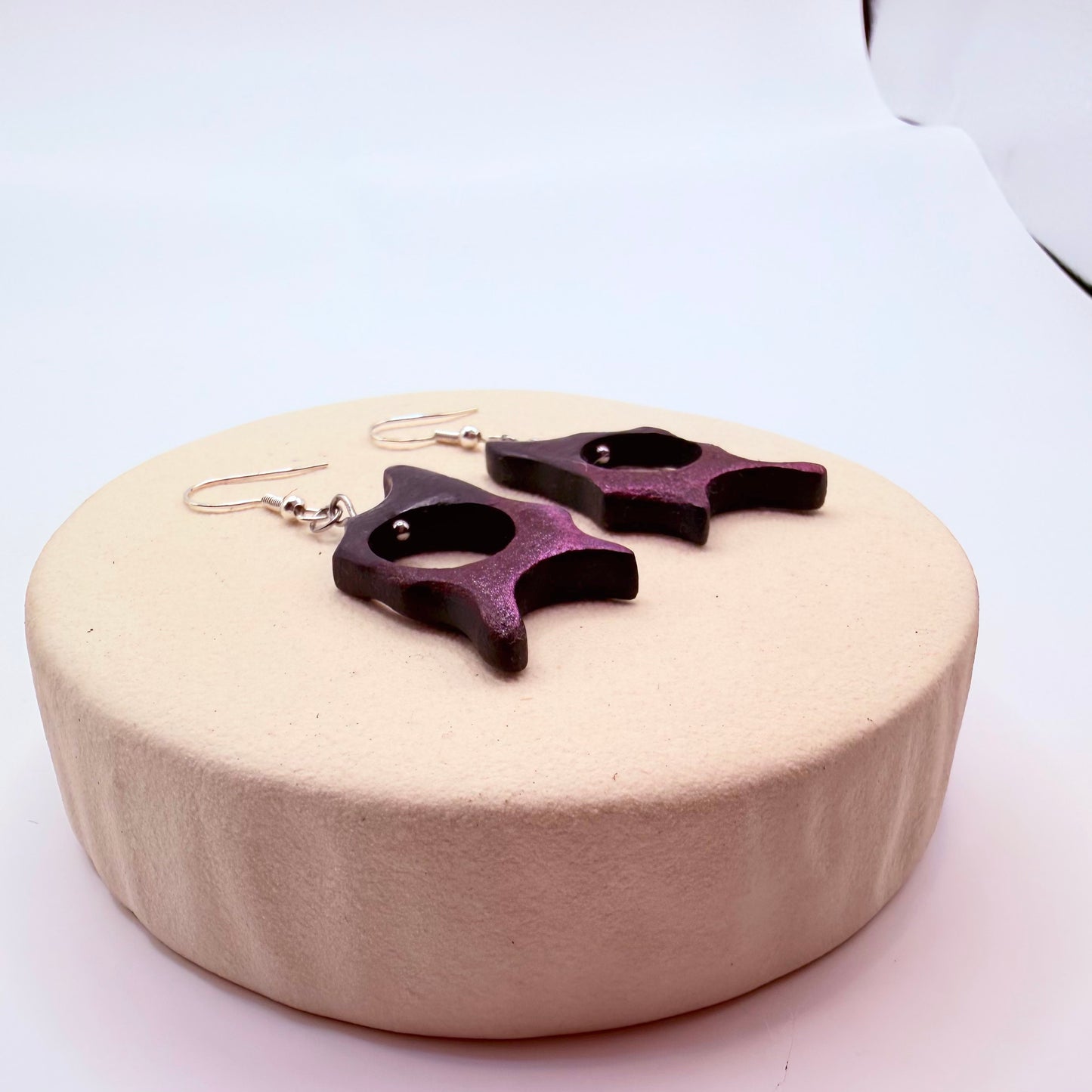 Lightweight wooden earrings with hand-carved abstract form and cut-out center