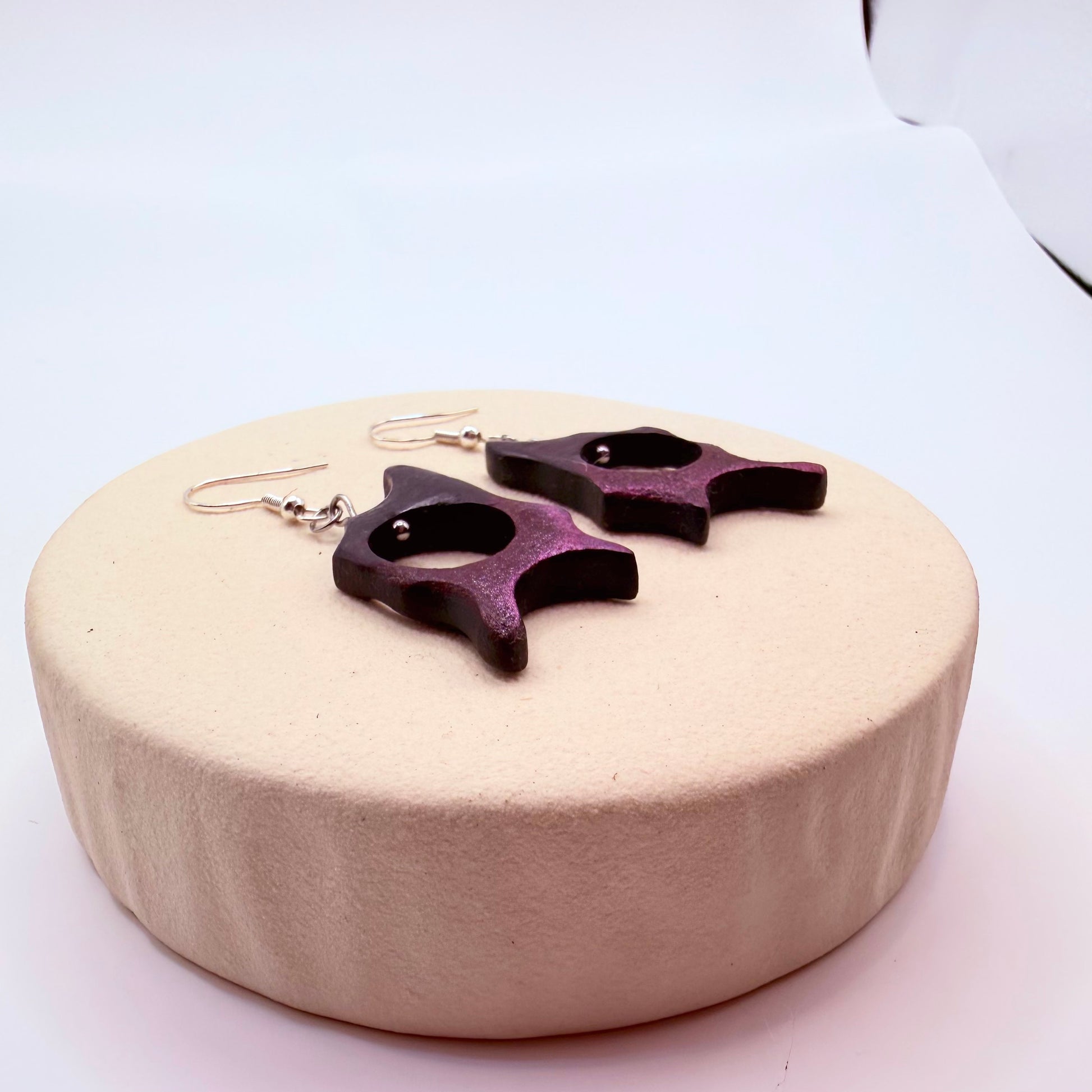 Lightweight wooden earrings with hand-carved abstract form and cut-out center