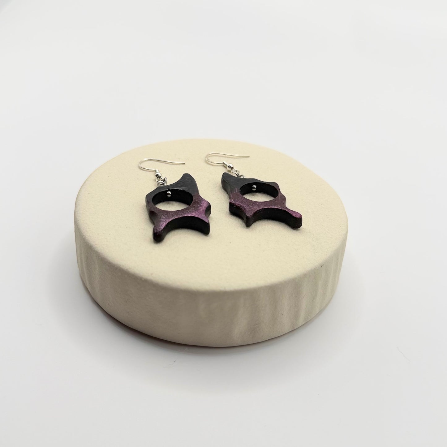 Unique handmade wooden earrings designed in an organic flowing shape