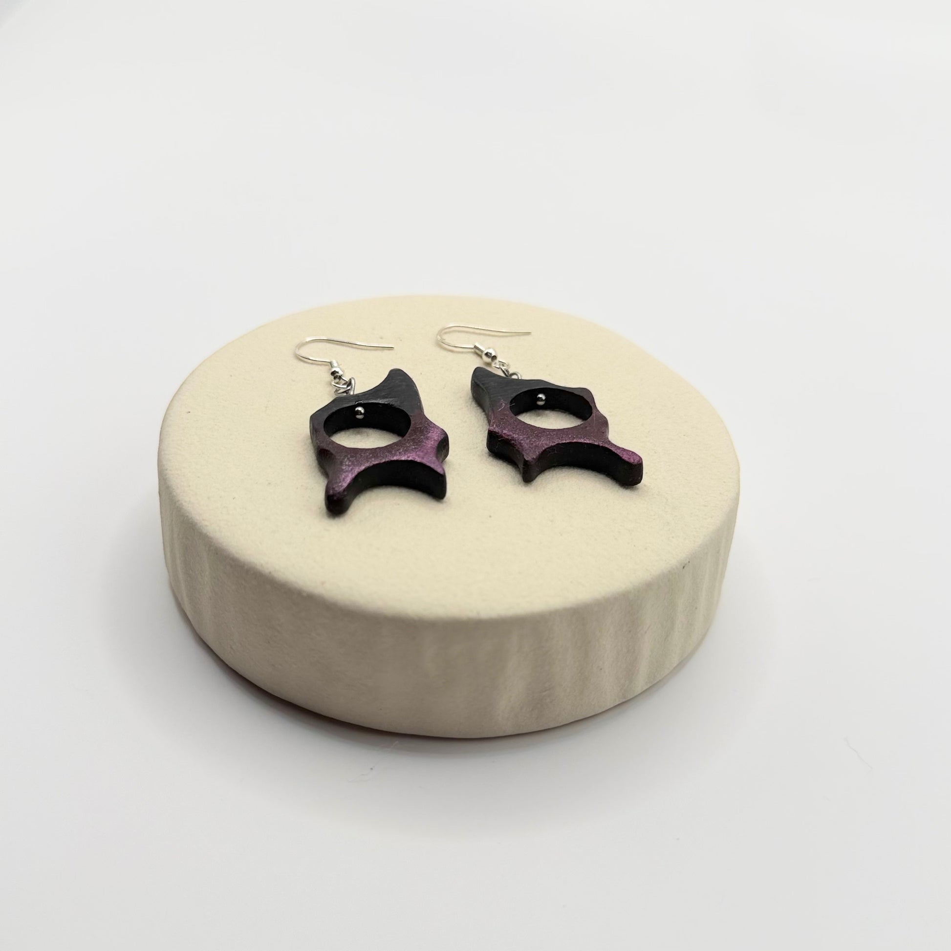 Unique handmade wooden earrings designed in an organic flowing shape
