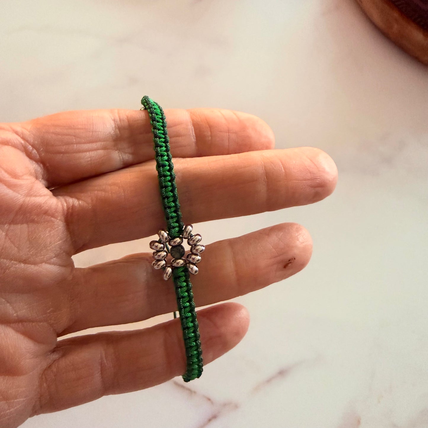 calming energy of nature with this handcrafted green macramé bracelet.