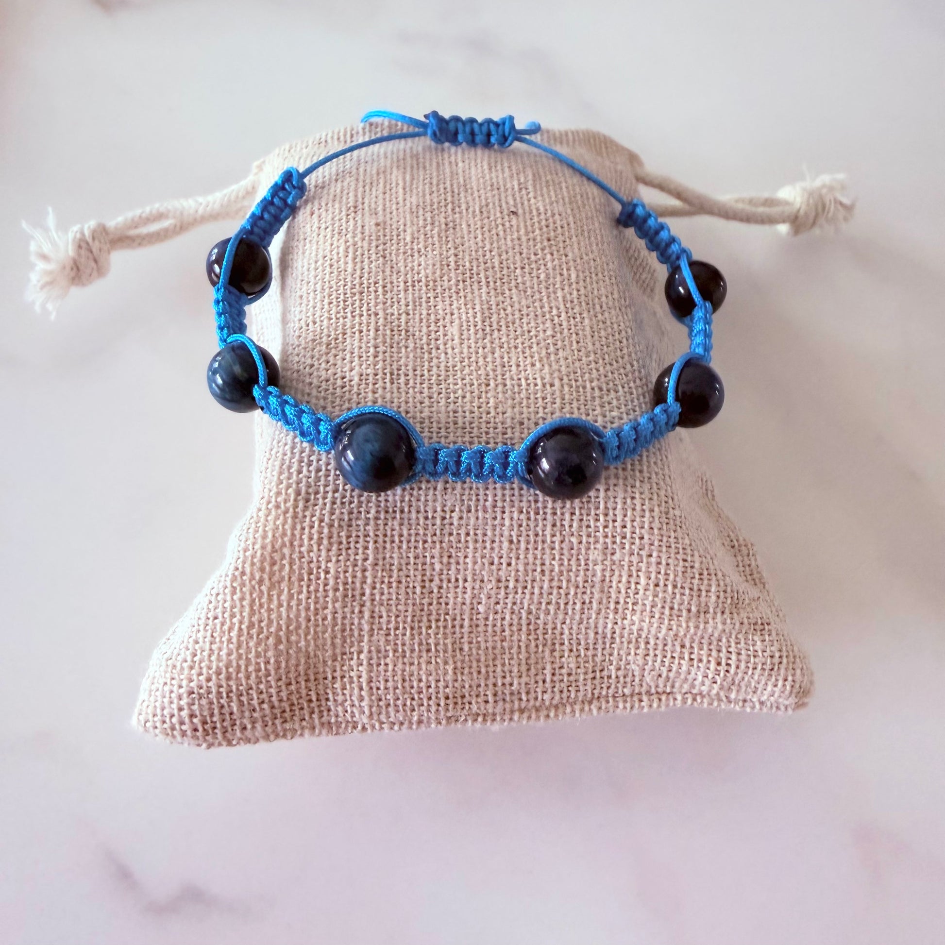 Adjustable macramé design with deep blue shimmer