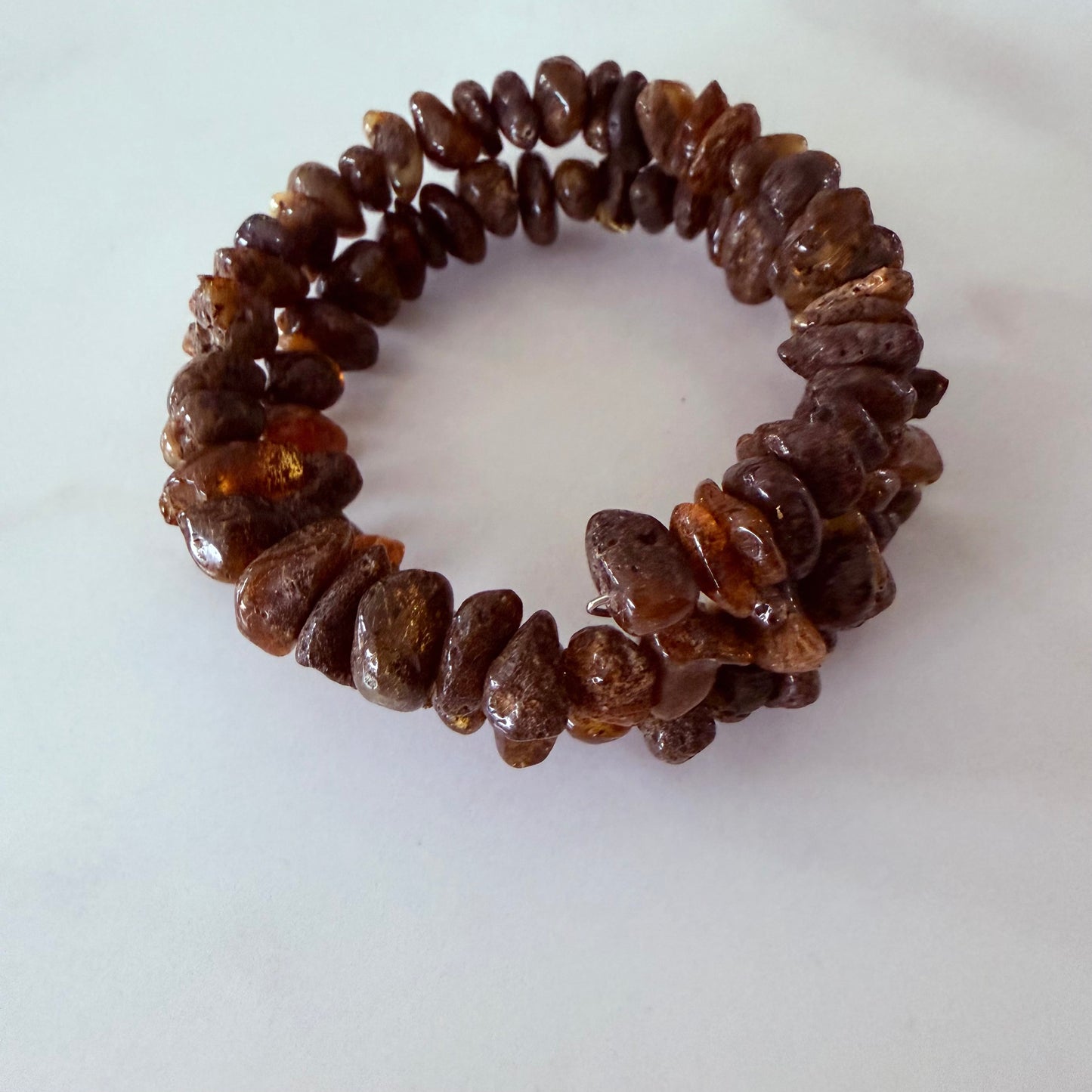 Brown beaded bracelet on a white background