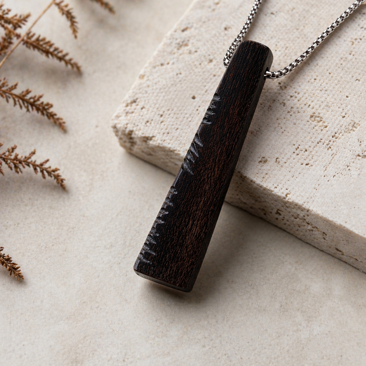 handcrafted bog oak pendant with ogham carving detail