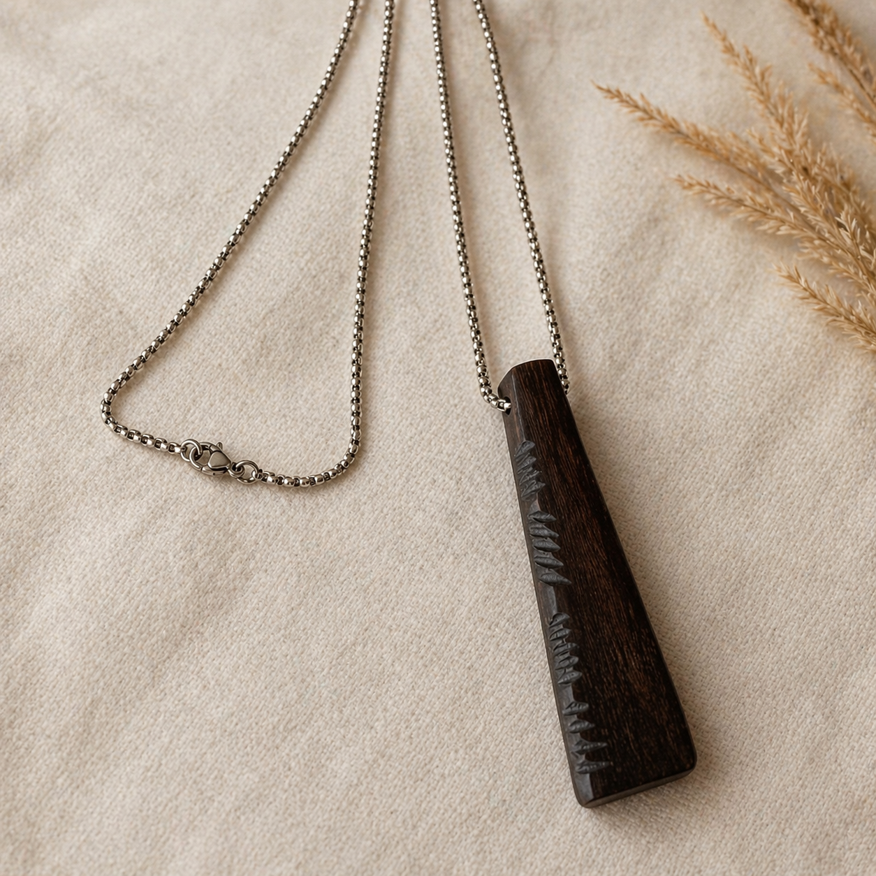 dark wooden pendant inspired by ogham script ireland