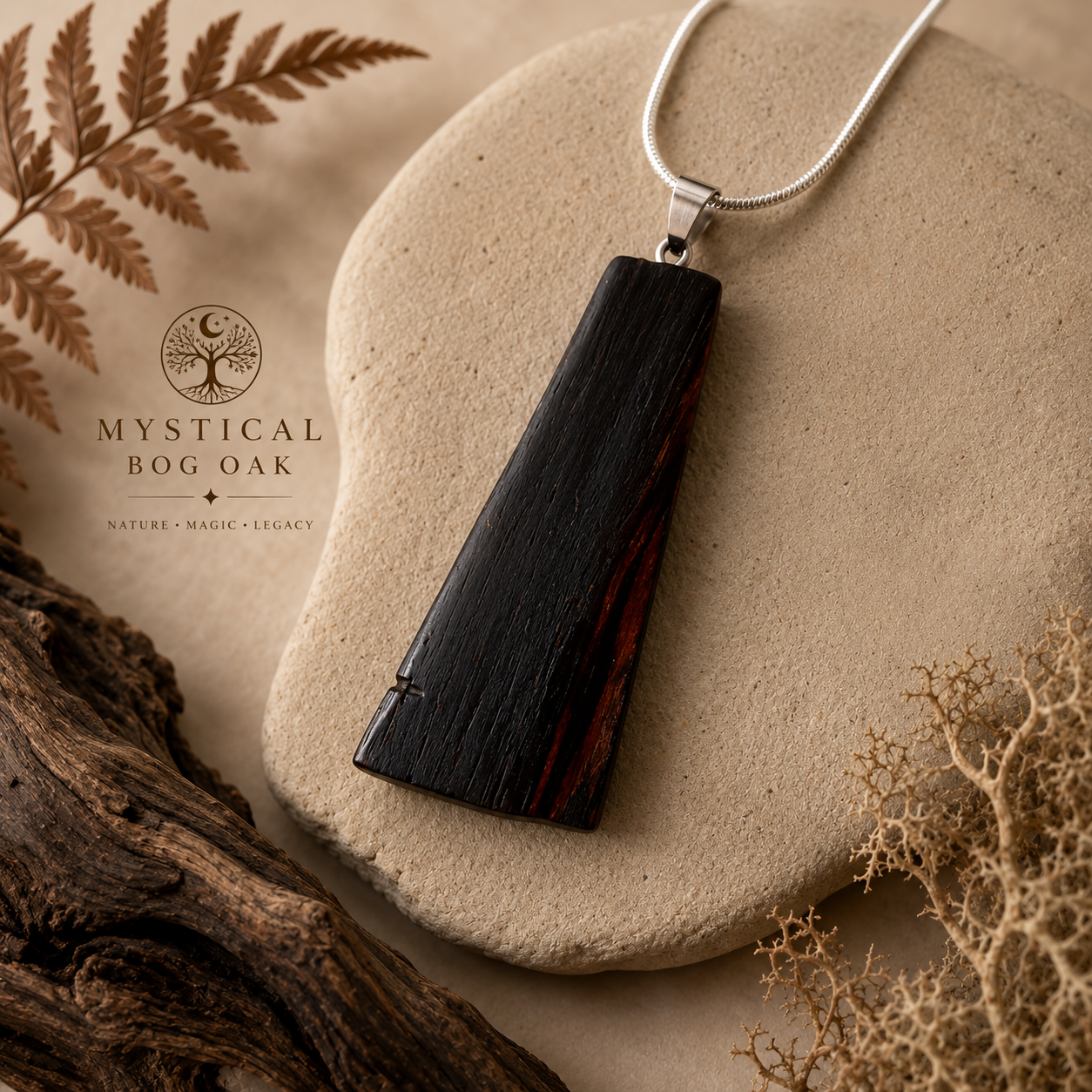 Wooden pendant necklace on a stone with 'Mystical Bog Oak' branding.