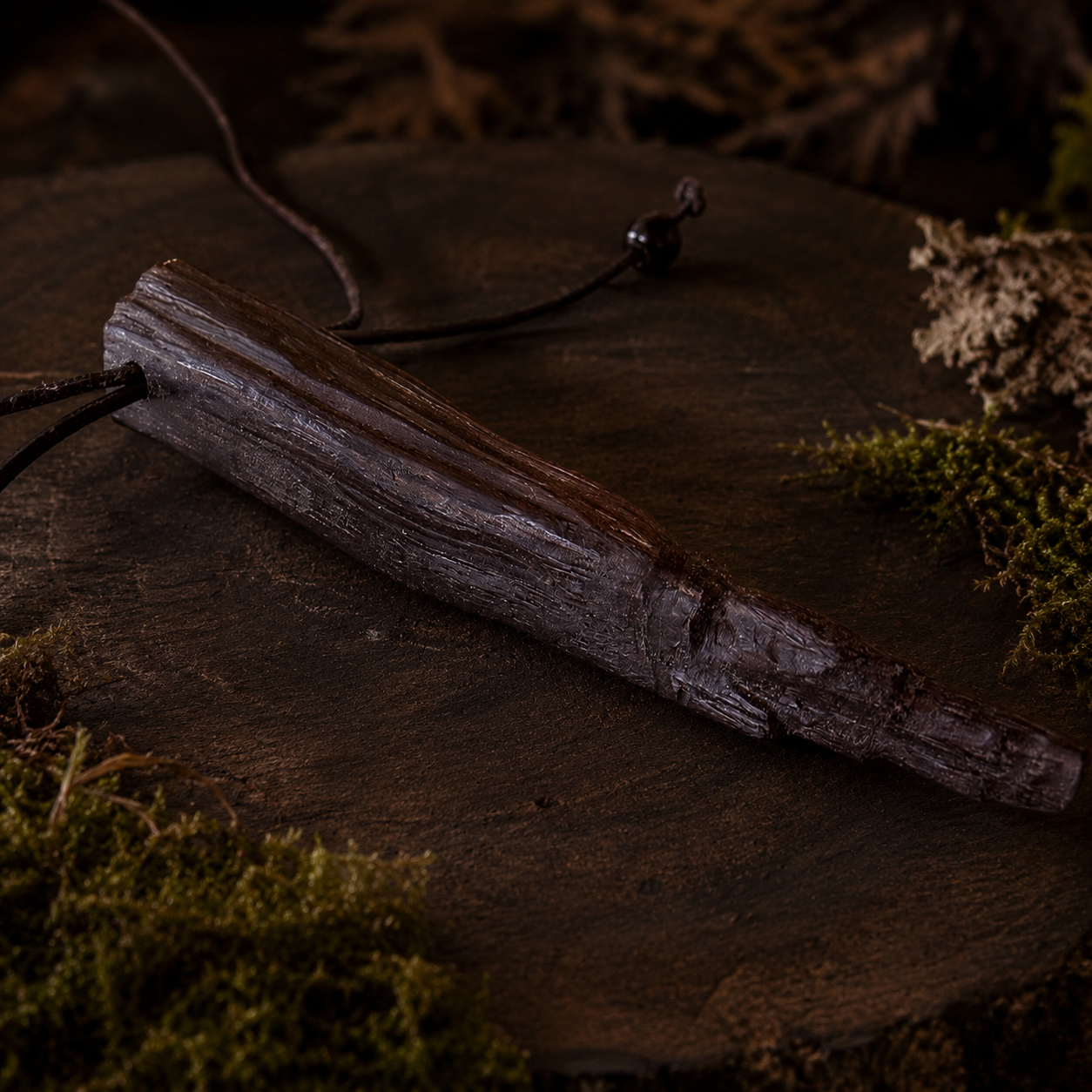 Vintage leather-bound book on a textured surface with a natural, earthy background