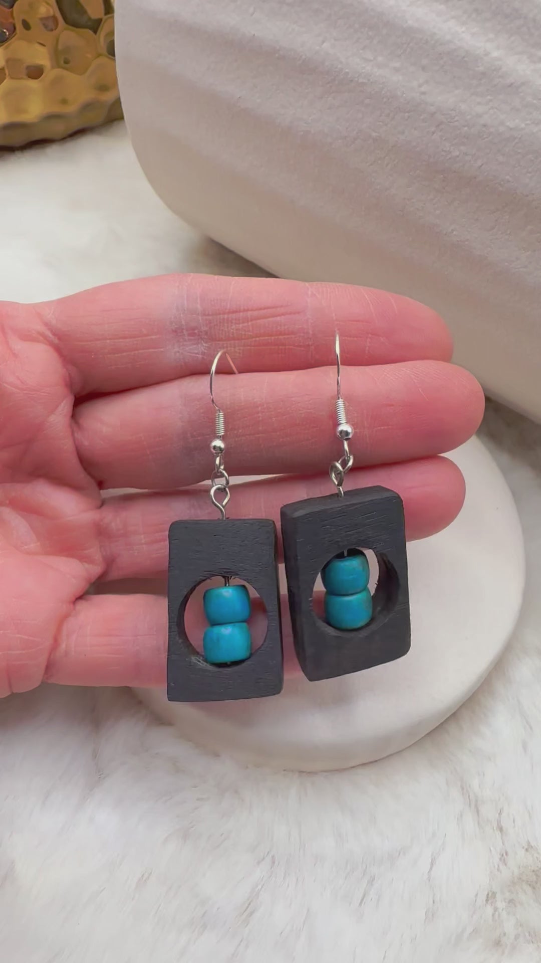 Artisan-crafted bog oak earrings paired with polished blue Howlite beads