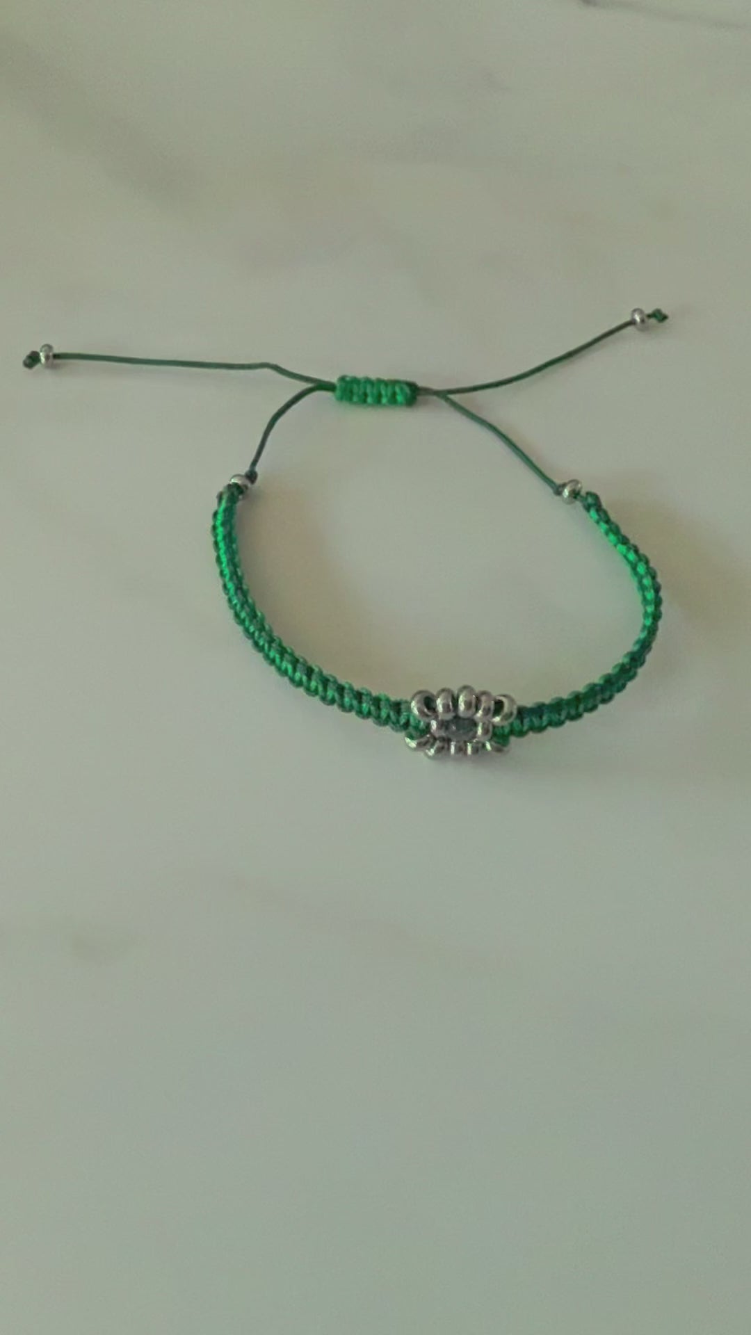 Designed with an adjustable sliding knot closure, this bracelet