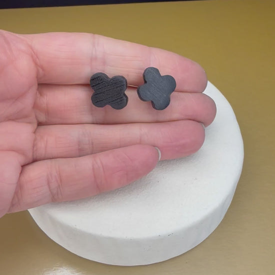 Elegant dark wood bog oak stud earrings with clover design, perfect for nature-inspired jewelry lovers.
