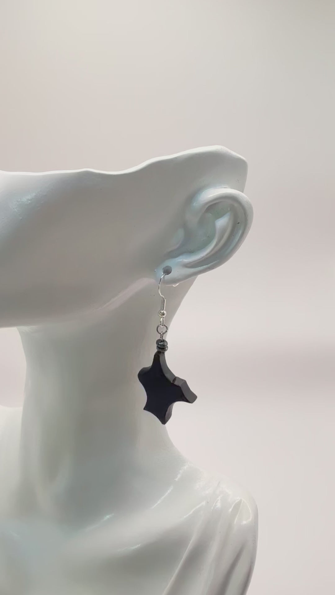 Close-up on the unique grain and texture of the ancient Irish Bog Oak in these earrings.