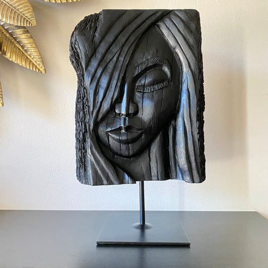 rish Bog Oak Hand Carved Woman Sculpture on a Black Metal Stand.